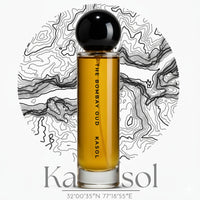 Kasol 60ml perfume bottle by The Bombay Oud with amber liquid, set against a topographic map background, evoking earthy and herbal notes.