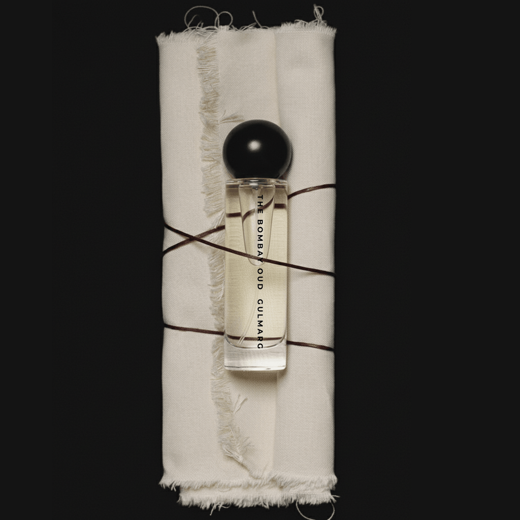 Gulmarg 60ml fragrance bottle wrapped in raw fabric and twine, highlighting artisanal and nature-inspired luxury packaging.