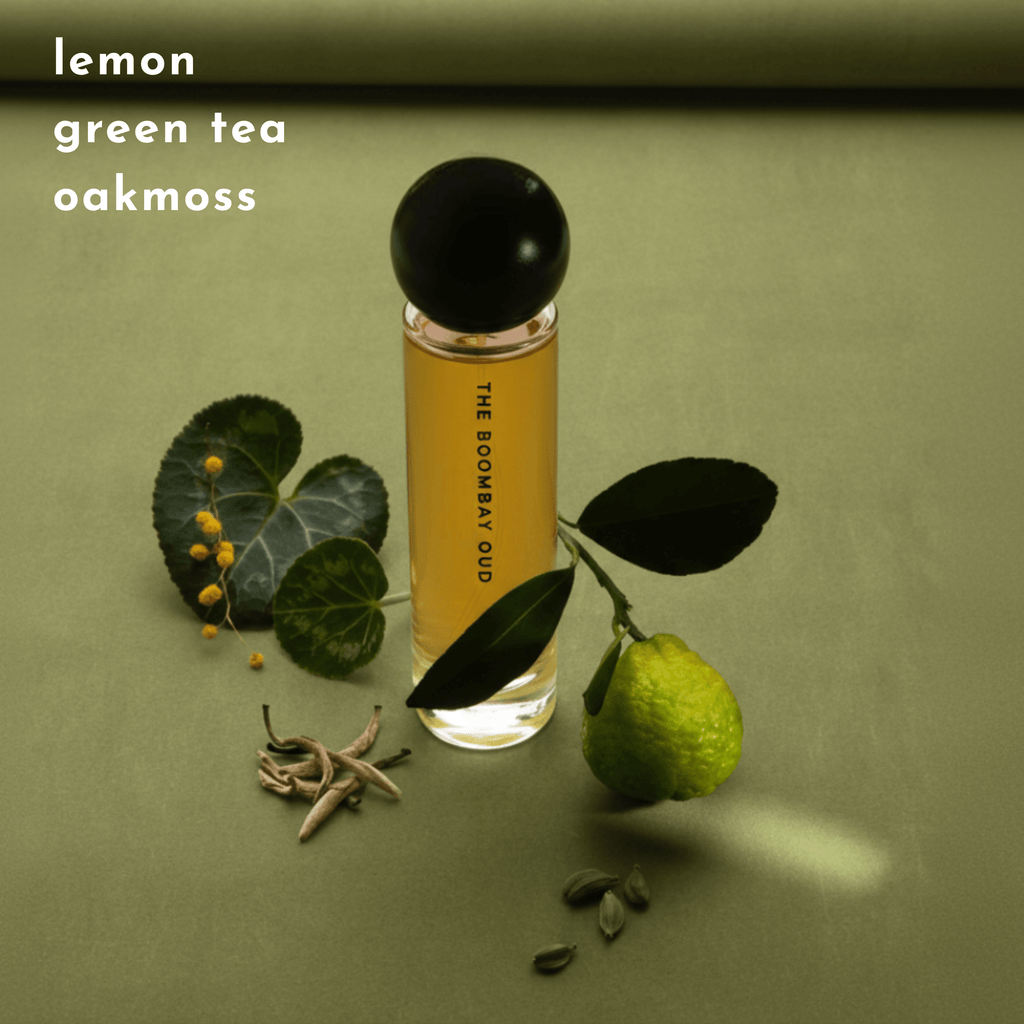 Gulmarg 60ml perfume displayed with lemon, green tea leaves, and oakmoss on a green background, showcasing its fresh notes.