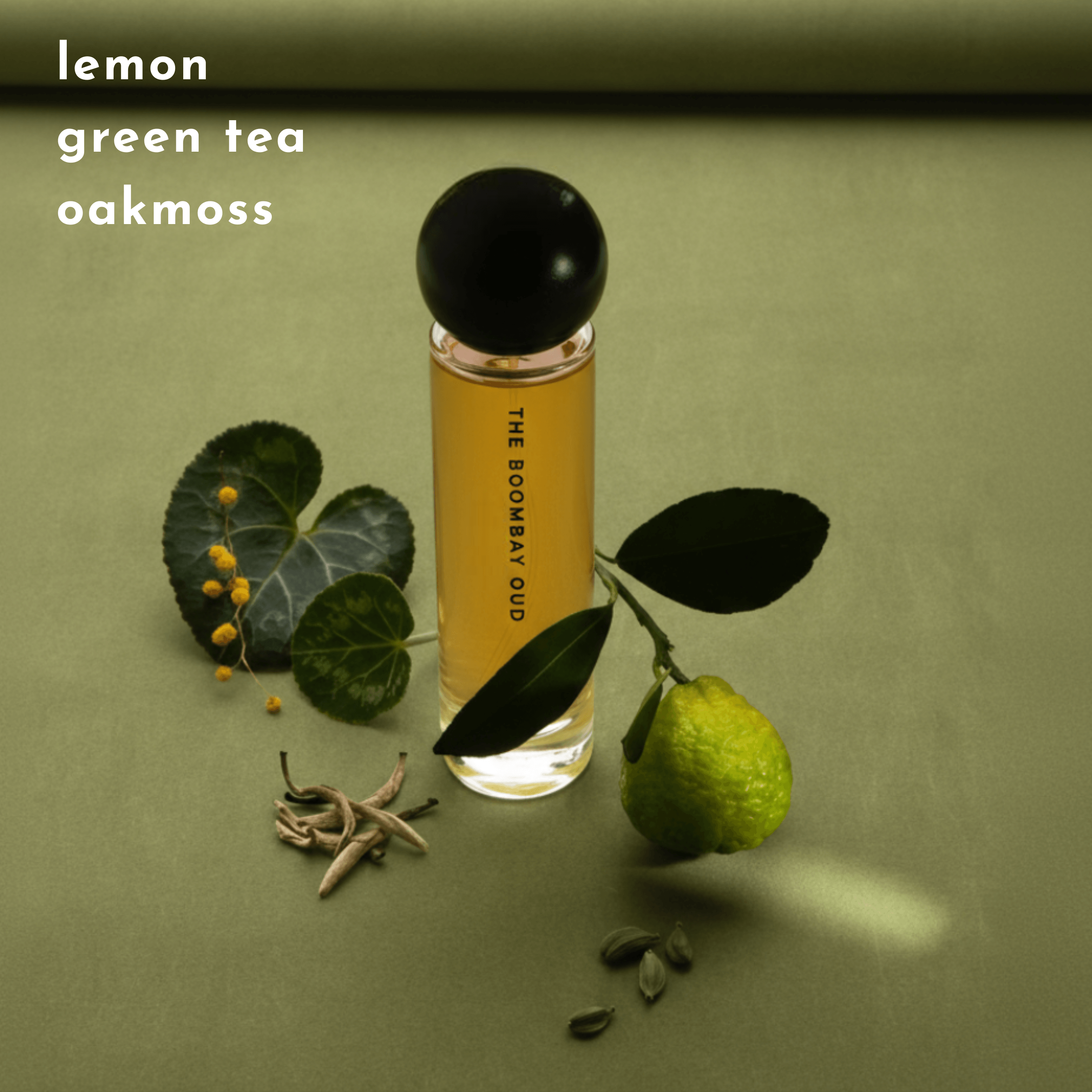 Gulmarg 60ml perfume displayed with lemon, green tea leaves, and oakmoss on a green background, showcasing its fresh notes.