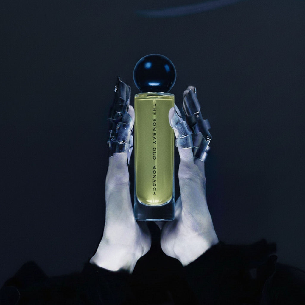 Monarch 60ml eau de parfum held by robotic hands against a dark background, showcasing its futuristic and luxurious design.