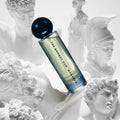 Monarch 60ml perfume bottle placed among classical white sculptures, symbolizing timeless elegance and artistic inspiration.