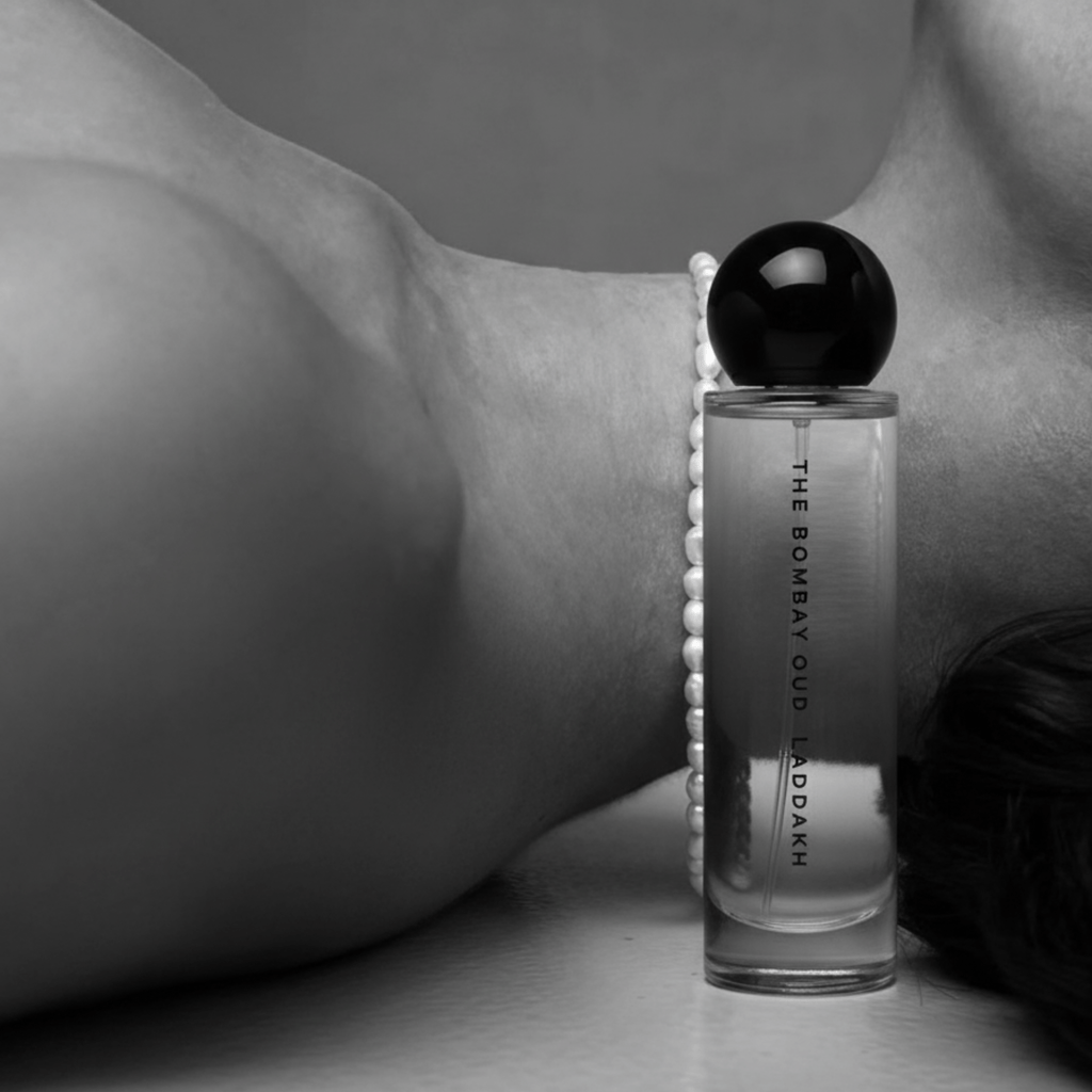 Laddakh 60ml perfume bottle resting beside a woman's neck, emphasizing its sensual and luxurious appeal in the personal care category.