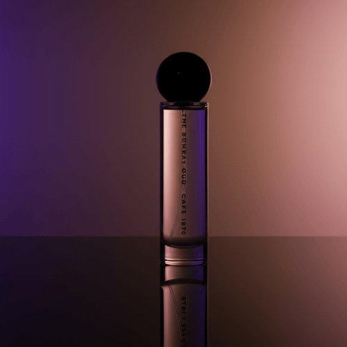 Cafe 1870 60ml perfume bottle by The Bombay Oud displayed under moody lighting, emphasizing its luxurious and cozy scent.