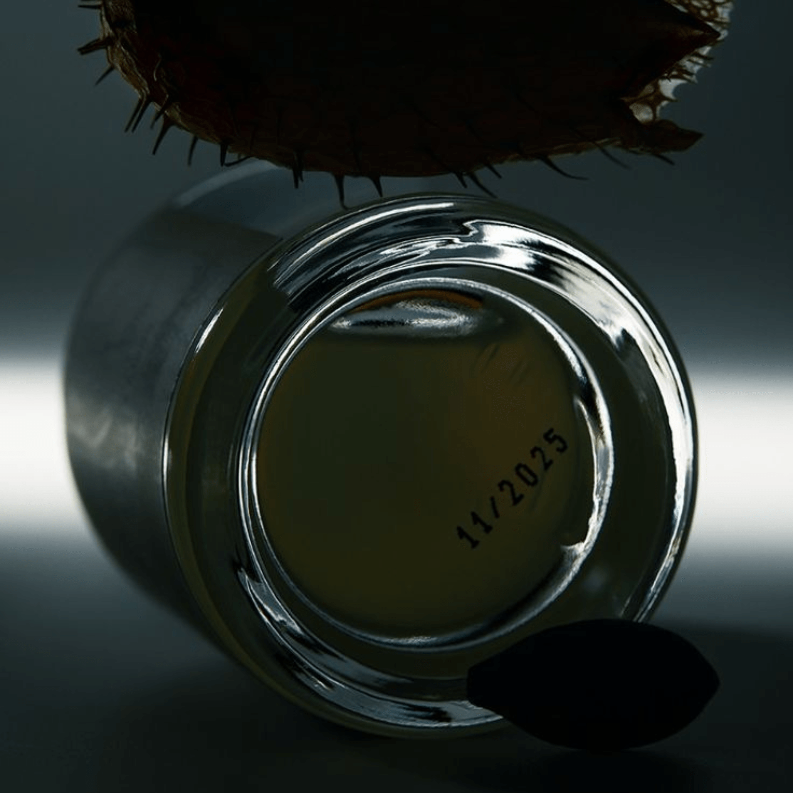 Lhasa 60ml perfume by The Bombay Oud in a sleek glass bottle with a black spherical cap, ideal for luxury fragrance lovers seeking mystique.