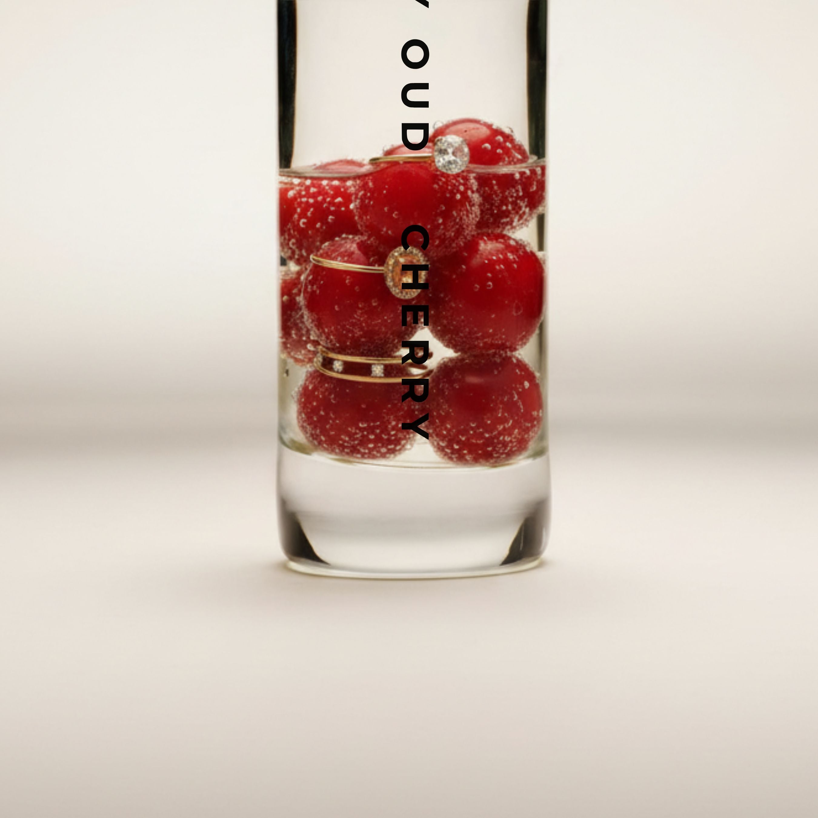 Cherry 60ml perfume bottle filled with red cherries and gold rings, symbolizing a rich, sensual fragrance in the perfumes & colognes category.