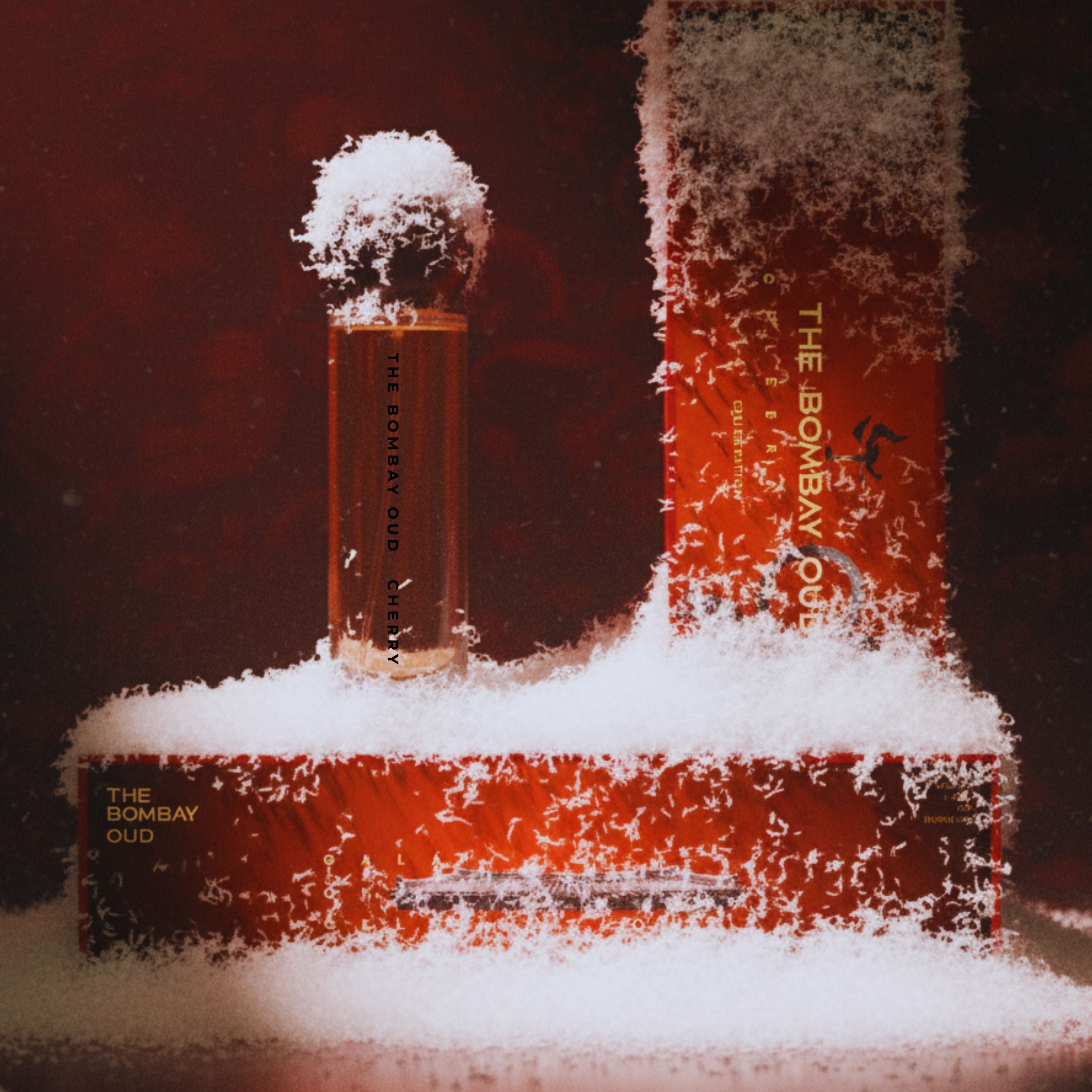 Cherry 60ml perfume by The Bombay Oud displayed with red packaging and snow accents, evoking a rich, warm, and sensual fragrance experience.