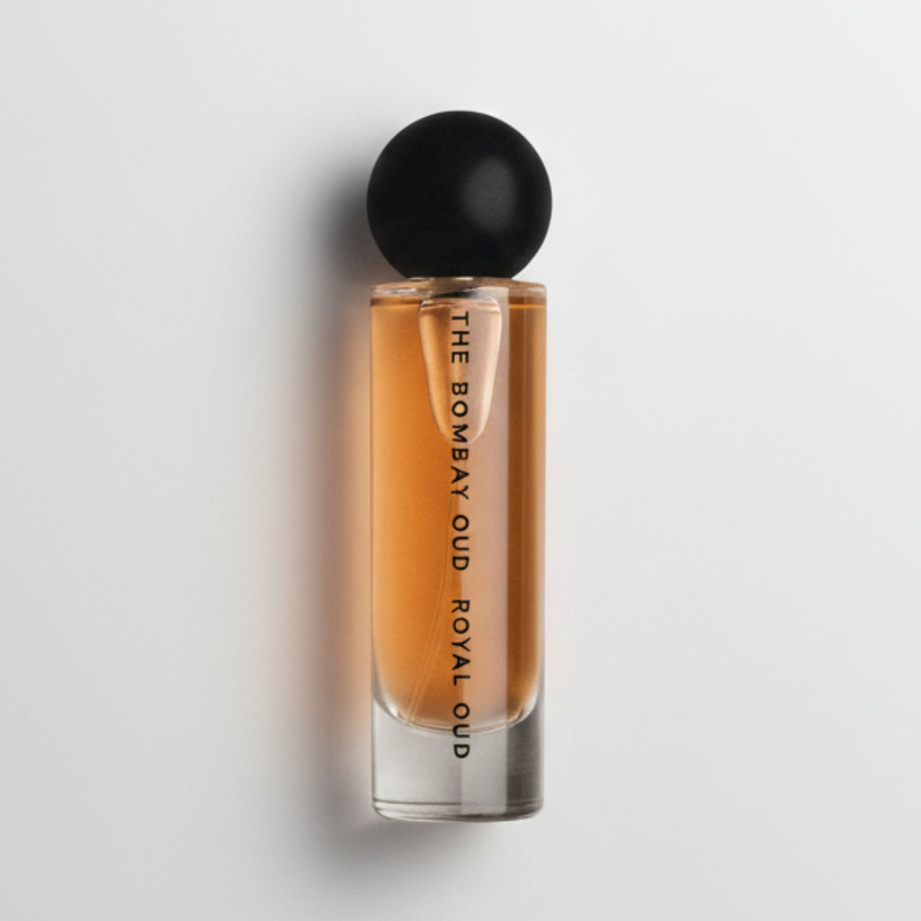 Royal Oud 60ml eau de parfum bottle with black cap and amber liquid, minimal design for luxury fragrance lovers.